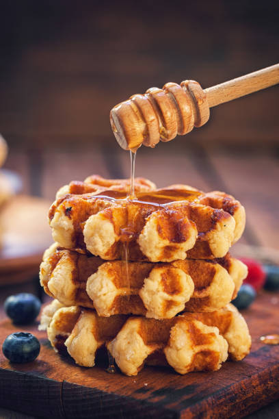 Belgian waffles with honey and fresh berries
