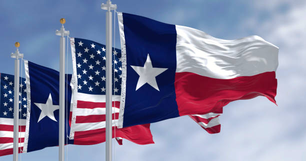 istock Texas state flags waving in the wind with american flag 2196246255