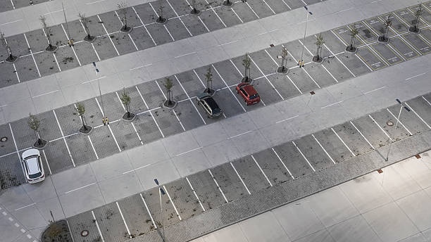 istock modern empty parking lot with bright LED street lights, air view 2196247119