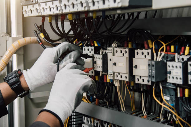 istock Electrician engineer tests electrical installations and wires on relay protection system. 2196247591
