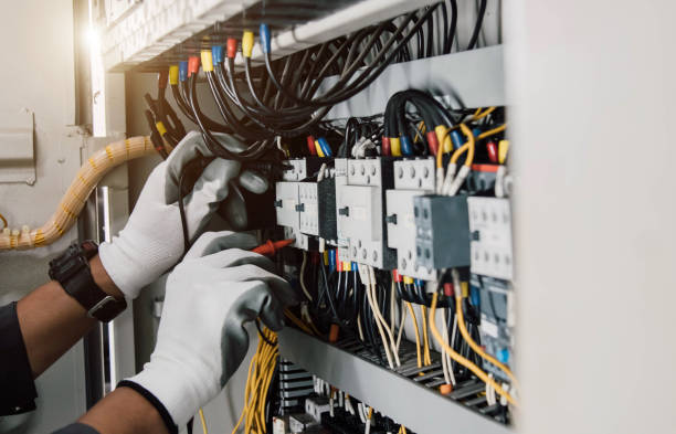istock Electrician engineer tests electrical installations and wires on relay protection system. 2196247592