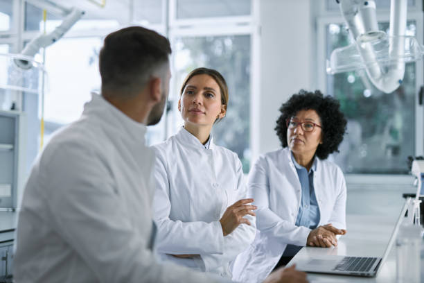 istock Scientists talking about scientific research in laboratory. 2196248287