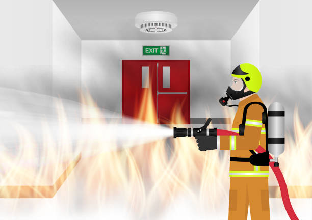 istock Firefighter Spraying Water to Extinguish Fire on Burning Building or Burning Office. 2196249320