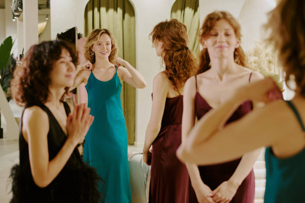 istock Women Estimating Dresses for Upcoming Party 2196249930