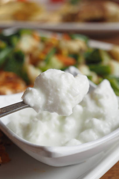 fresh yogurt in a bowl on table