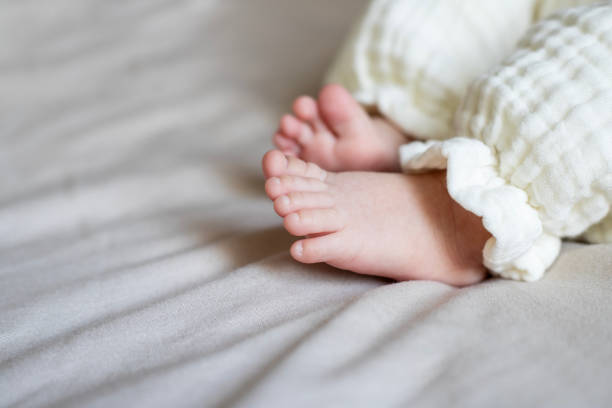 istock Foot of newborn baby 2196252348