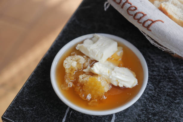 istock butter cream and honey in a bowl on table . 2196252914
