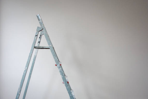 Metal ladder in an empty room