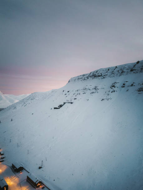 istock Snowy mountain ridge over Longyearbyen, Svalbard at sunset in winter 2196261641