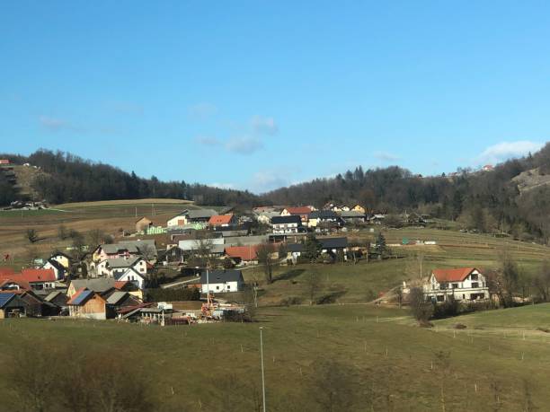 istock Grassland and village in Slovenia 2196262957