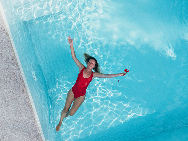 istock Woman Relaxing in a Modern Pool 2196264087