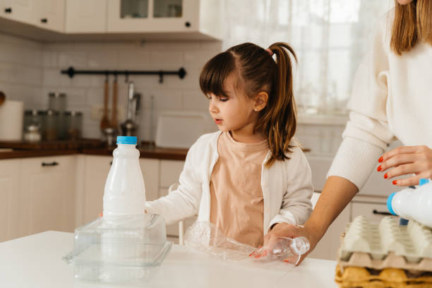 istock A family recycling moment , teaching sustainability 2196269011