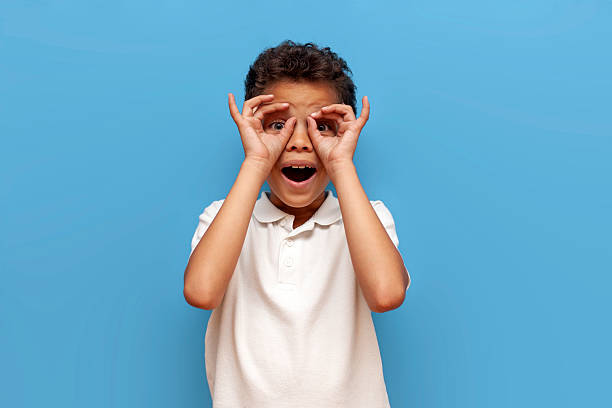 Emotive series with young boy against blue background