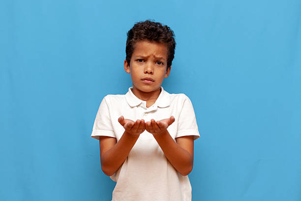 Emotive series with young boy against blue background