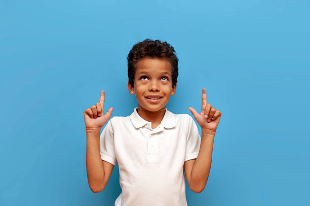 istock Emotive series with young boy against blue background 2196270460