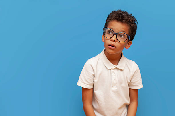 istock Emotive series with young boy against blue background 2196270462