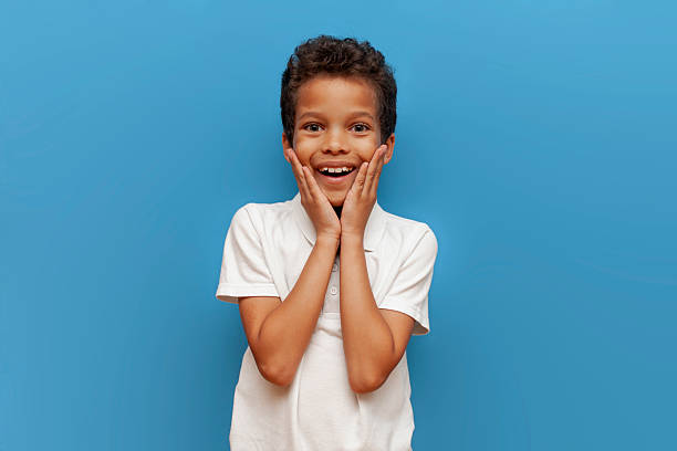 istock Emotive series with young boy against blue background 2196270482
