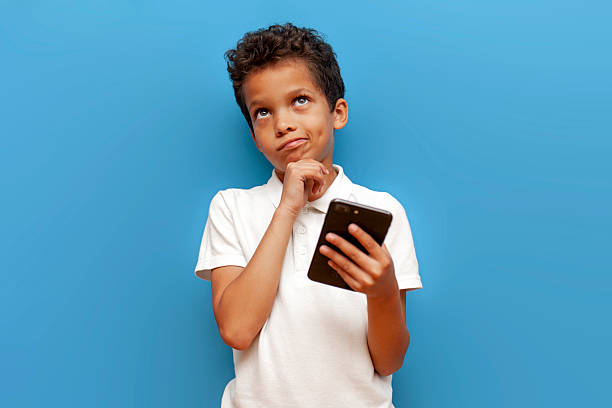 Emotive series with young boy against blue background