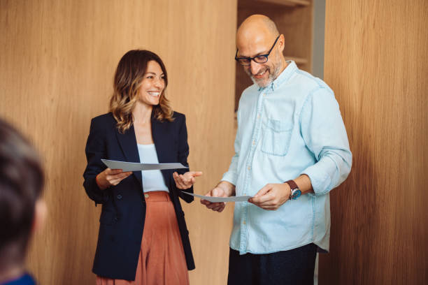 Coworkers Engaging in a Cheerful Discussion in an Office Environment