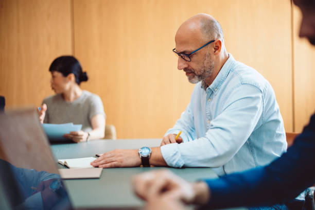 istock Focused Professionals Working Together in a Modern Business Environment 2196270982