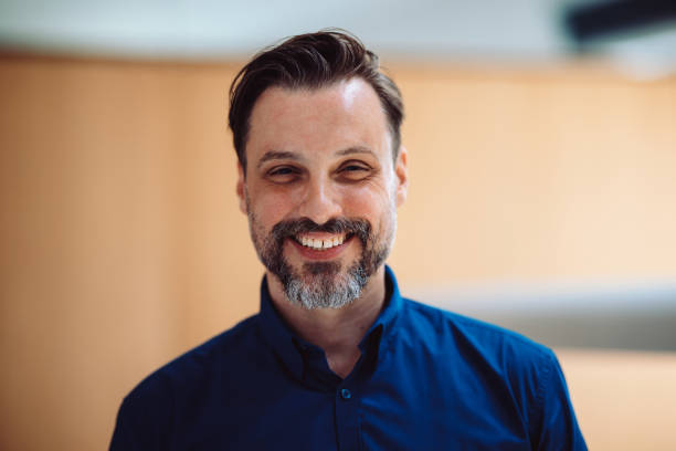 istock Cheerful Man Smiling Brightly in a Casual Indoor Setting 2196270991