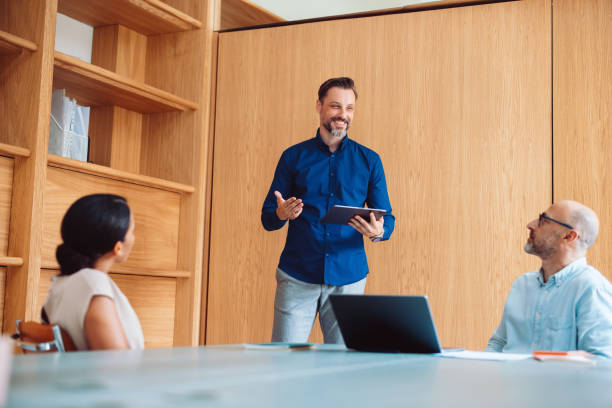 Professional Team in Discussion During an Office Presentation Meeting