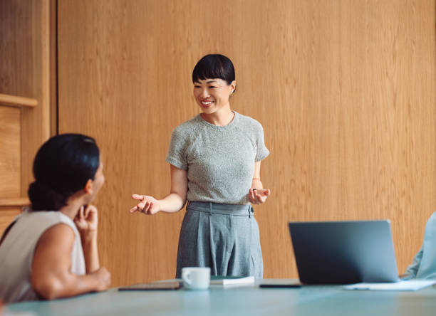 istock Professional Businesswoman Presenting in a Modern Office Setting 2196271017