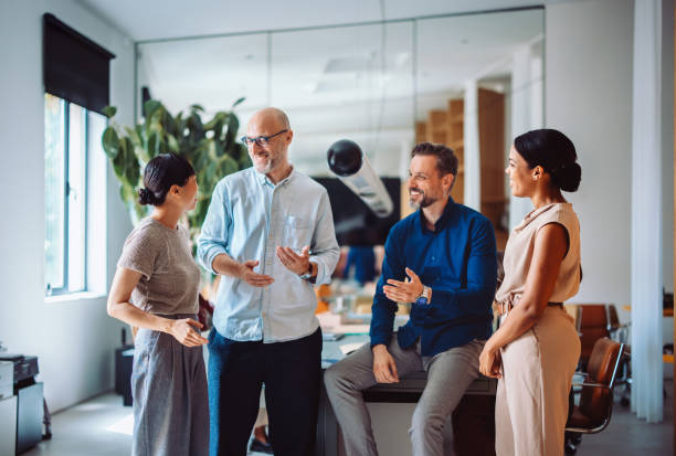 istock Professional Team Collaborating Happily in a Modern Office Environment 2196271028