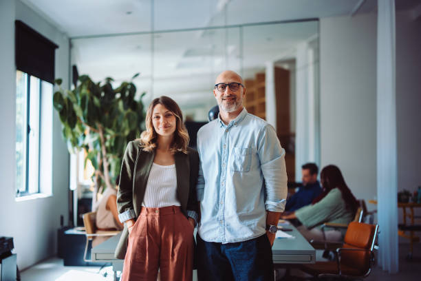 Professional Team Posing in a Modern and Well-Lit Office Environment