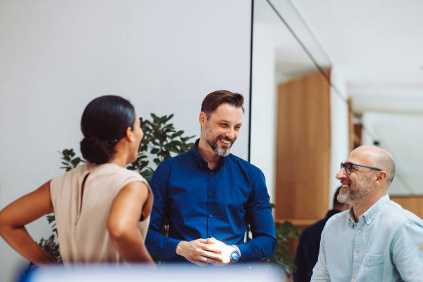 Professionals Having a Lively Discussion in a Modern Office Environment