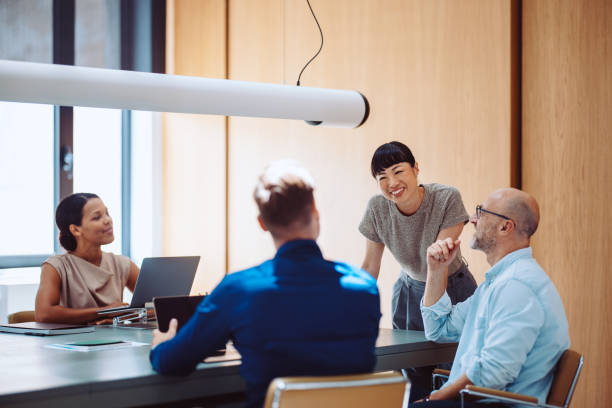 istock Professional Team Collaborating in Modern Office Space During an Informal Meeting 2196271071