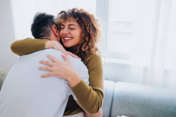 istock Happy Couple Embracing Inside Bright Cozy Room 2196271231