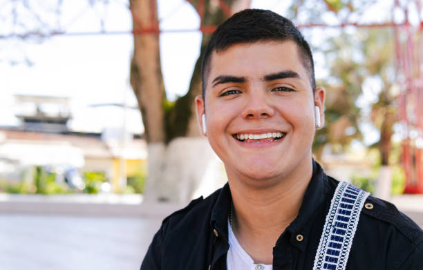 istock Young latino freelancer smiling with earbuds in colombia 2196272298