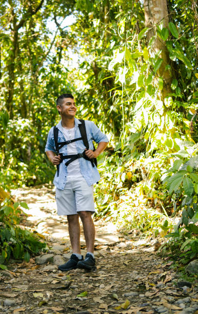 istock Young backpacker exploring lush colombian jungle trail 2196272640