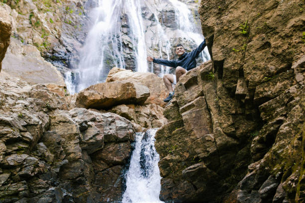 istock Adventurous traveler exploring colombian waterfall 2196273139