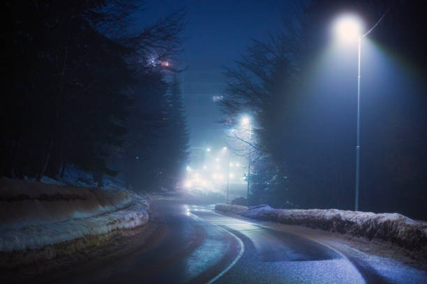 istock Difficult foggy and snowy night time for driving 2196275424