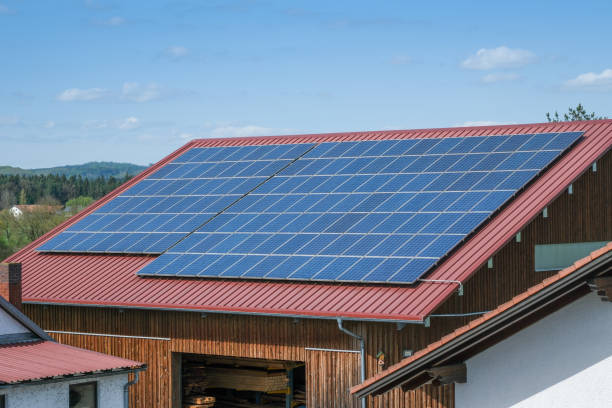 istock Extensive Solar Panel Array on the Metal Roof of a Large Industrial Facility 2196278950