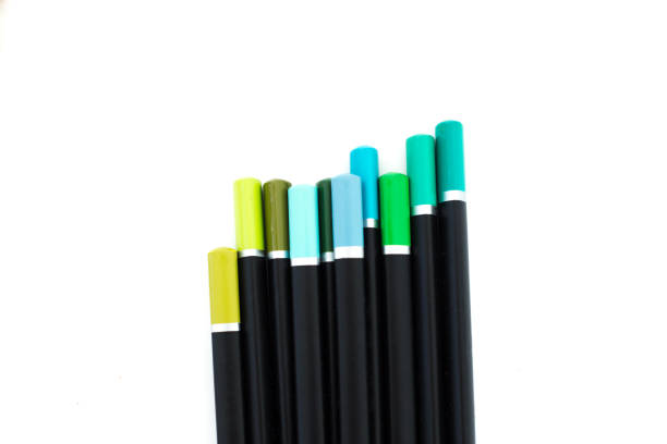 Group of Blue and Green Colored Pencils, white background, copy space.
