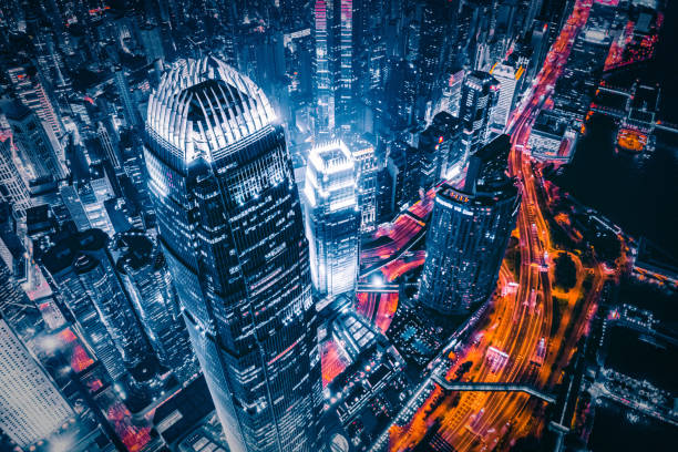 istock Illuminated urban skyline with vibrant traffic trails 2196280335