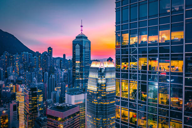 Hong kong skyline showing modern skyscrapers at sunset