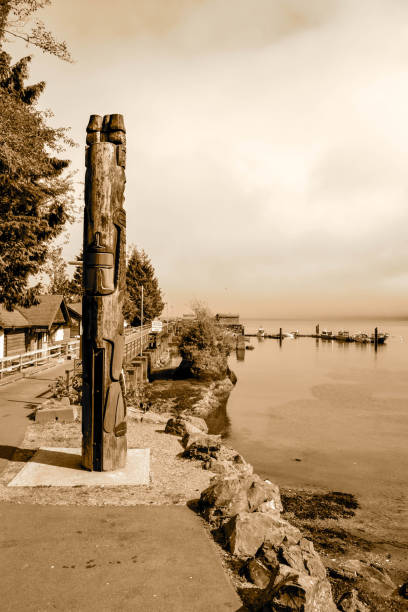 istock Indigenous Totem Pole Overlooking Serene Coastal Village 2196281012