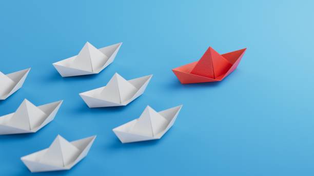 istock Different business concept.new ideas. paper art style. creative idea.Business competition concept with Colorful paper ships.3D rendering on blue background. 2196283710