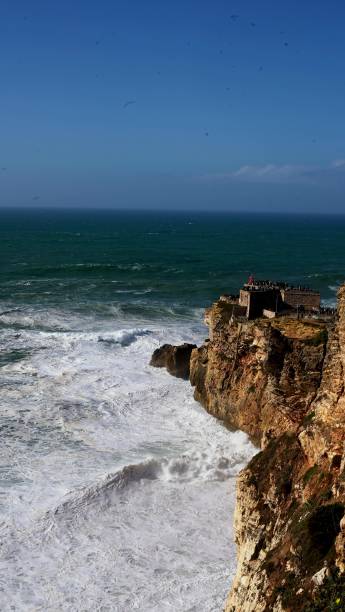 istock view from a high cliff on the waves in Nazare 2196283890