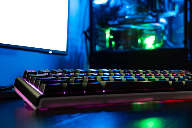 istock The concept of a desktop consisting of a keyboard with a backlight, a powerful computer, and a modern monitor against which a white background 2196285230