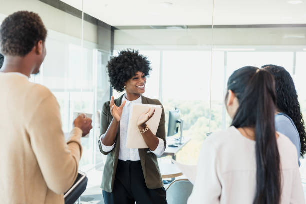 istock Businesswoman Leading a Team Meeting, Discussing Project Ideas 2196289433