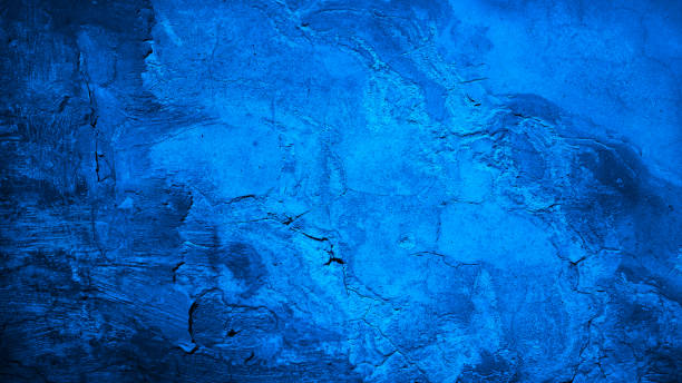 istock Black cobalt blue concrete wall surface. Grunge texture background. Close-up. Paint. Crack old rough broken damaged crumbled. Dark light. Building facade exterior. 2196290517