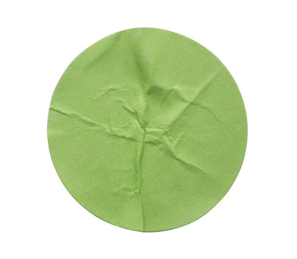 istock Blank green round adhesive paper sticker label isolated on white background 2196292465