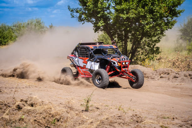 istock Outdoor activities UTV buggy moves on dusty road. 4x4, extreme, adrenalin. 2196294169