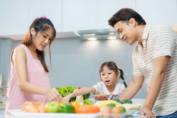 istock Asian family preparing a food in kitchen. 2196297157