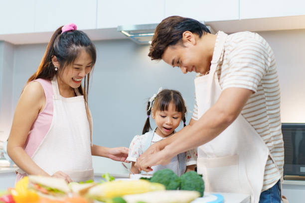 istock Asian family preparing a food in kitchen. 2196297183